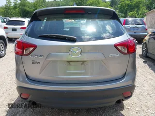 2014 Mazda CX-5 Sport with VIN JM3KE2BEXE0329303, listed as a IAAI auction lot 42556908 with 127,836 mi miles and . Bid and sale history available at DreamBid. Image 16.