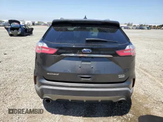 2020 Ford Edge SEL с VIN 2FMPK3J97LBA48892, выставлен на аукционе Copart как лот 58008145 с пробегом 52 588 миль миль и Списание • Salvage title. История ставок и продаж доступна на DreamBid. Изображение 6.