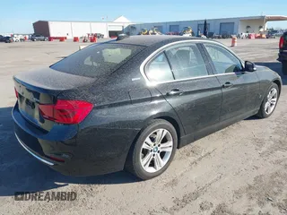2017 BMW 3 Series 330e iPerformance with VIN WBA8E1C34HA156688, listed as a IAAI auction lot 41753490 with 74,130 mi miles. Bid and sale history available at carsss.com. Image 4.