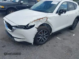 2018 Mazda CX-5 Touring z VIN JM3KFACM6J1419663, wystawiony jako IAAI lot #41879677 z przebiegiem 115 224 mil mil oraz . Historia ofert i sprzedaży dostępna na DreamBid. Obrazek 6.