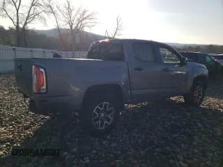 2021 GMC Canyon 4WD AT4 w/Cloth with VIN 1GTG6FEN0M1236099, listed as a Copart auction lot 80911974 with 122,672 mi miles and Salvage Title. Bid and sale history available at carsss.com. Image 3.