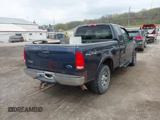 2002 Ford F-150 XL with VIN 2FTPX18L32CA67220, listed as a IAAI auction lot 42077154 with 233,409 mi miles. Bid and sale history available at carsss.com. Image 4.