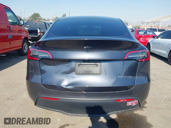 2022 Tesla Model Y Long Range z VIN 7SAYGDEE4NF522698, wystawiony jako IAAI lot #41287885 z przebiegiem 82 306 mil mil oraz . Historia ofert i sprzedaży dostępna na DreamBid. Obrazek 16.