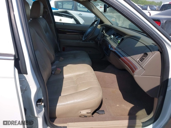 2003 Mercury Grand Marquis LS Premium with VIN 2MEFM75W33X669341, listed as a IAAI auction lot 42063018 with 124,047 mi miles. Bid and sale history available at carsss.com. Image 5.