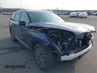 2021 Lincoln Aviator Reserve z VIN 5LM5J7XC1MGL09932, wystawiony jako IAAI lot #41758557 z przebiegiem 107 171 mil mil oraz . Historia ofert i sprzedaży dostępna na DreamBid. Obrazek 1.