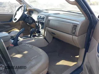 2004 Jeep Grand Cherokee with VIN 1J8GX48S24C266933, listed as a IAAI auction lot 41497122 with 200,899 mi miles and . Bid and sale history available at DreamBid. Image 5.