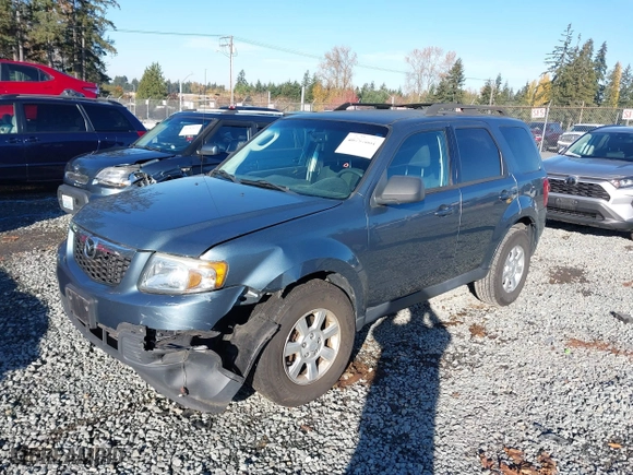 2010 Mazda Tribute Touring with VIN 4F2CY9C73AKM04595, listed as a IAAI auction lot 40797681 with 122,774 mi miles. Bid and sale history available at carsss.com. Image 17.