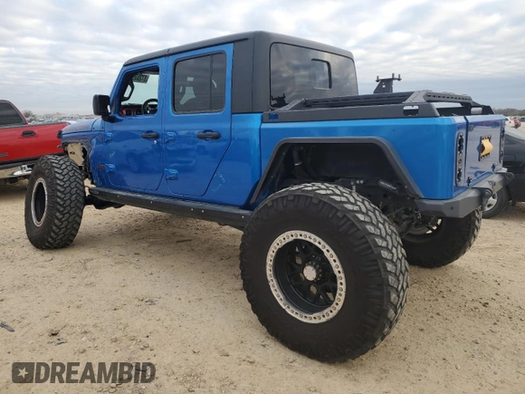 2021 Jeep Gladiator Rubicon with VIN 1C6JJTBM1ML611203, listed as a Copart auction lot 87203924 with 27,645 mi miles and Salvage title. Bid and sale history available at DreamBid. Image 2.