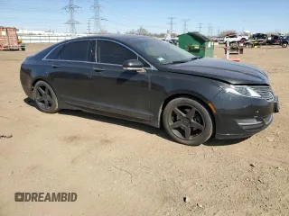 2015 Lincoln MKZ z VIN 3LN6L2GK1FR613074, wystawiony jako Copart lot #52157775 z przebiegiem 118 144 mil mil oraz Szkoda całkowita • Salvage title. Historia ofert i sprzedaży dostępna na DreamBid. Obrazek 4.