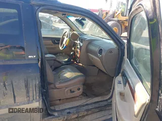 2004 GMC Envoy SLT z VIN 1GKET16PX46140720, wystawiony jako IAAI lot #41661912 z przebiegiem 252 524 mil mil oraz . Historia ofert i sprzedaży dostępna na DreamBid. Obrazek 5.