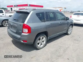 2011 Jeep Compass Latitude with VIN 1J4NT1FB4BD246549, listed as a IAAI auction lot 42156761 with 232,739 mi miles. Bid and sale history available at carsss.com. Image 4.