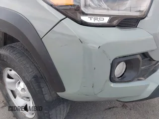 2022 Toyota Tacoma SR with VIN 3TMCZ5AN0NM507320, listed as a IAAI auction lot 42220296 with 33,342 mi miles and . Bid and sale history available at DreamBid. Image 6.