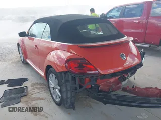 2018 Volkswagen Beetle S with VIN 3VW5DAAT3JM506460, listed as a IAAI auction lot 41556365 with 49,674 mi miles and . Bid and sale history available at DreamBid. Image 3.