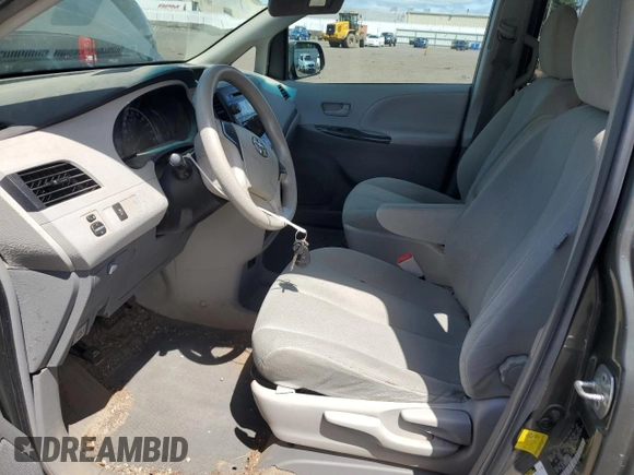 2012 Toyota Sienna with VIN 5TDZK3DC8CS198495, listed as a Copart auction lot 57335205 with 66,786 mi miles and Salvage title. Bid and sale history available at DreamBid. Image 7.