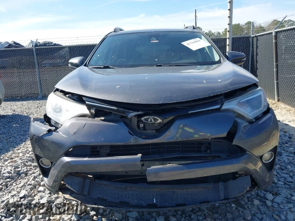 2018 Toyota RAV4 XLE with VIN 2T3WFREV2JW450019, listed as a IAAI auction lot 41704084 with 257,737 mi miles. Bid and sale history available at carsss.com. Image 12.