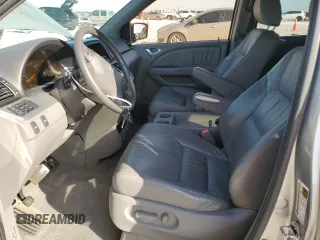 2009 Honda Odyssey EX-L with VIN 5FNRL38799B034292, listed as a Copart auction lot 52547205 with 116,658 mi miles and Salvage Title. Bid and sale history available at DreamBid. Image 7.
