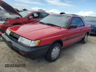 1987 Nissan Sentra z VIN JN1PB2411HU026525, wystawiony jako Copart lot #78997744 z przebiegiem 65 716 mil mil oraz Nie do naprawy. Historia ofert i sprzedaży dostępna na DreamBid. Obrazek 1.