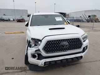 2019 Toyota Tacoma SR z VIN 3TMCZ5AN4KM220154, wystawiony jako IAAI lot #41602065 z przebiegiem 92 345 mil mil oraz . Historia ofert i sprzedaży dostępna na DreamBid. Obrazek 13.