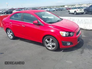 2014 Chevrolet Sonic LTZ z VIN 1G1JE5SH6E4119136, wystawiony jako IAAI lot #42359767 z przebiegiem 126 492 mil mil oraz . Historia ofert i sprzedaży dostępna na DreamBid. Obrazek 1.