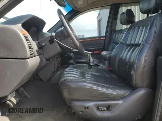 1999 Jeep Grand Cherokee Limited with VIN 1J4GW68N4XC679841, listed as a Copart auction lot 59760015 with 155,366 mi miles and Salvage title. Bid and sale history available at DreamBid. Image 7.