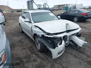 2014 BMW 3 Series Gran Turismo 328i xDrive with VIN WBA3X5C5XED559713, listed as a IAAI auction lot 42078622 with 68,233 mi miles. Bid and sale history available at carsss.com. Image 1.
