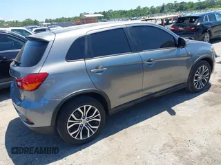 2018 Mitsubishi Outlander SE with VIN JA4AP3AW9JU012575, listed as a IAAI auction lot 42303672 with 97,524 mi miles and . Bid and sale history available at DreamBid. Image 4.