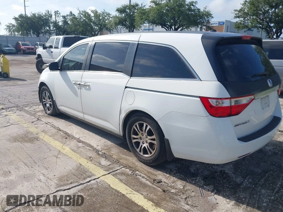 2012 Honda Odyssey EX-L z VIN 5FNRL5H61CB032353, wystawiony jako IAAI lot #42471691 z przebiegiem 186 257 mil mil oraz . Historia ofert i sprzedaży dostępna na DreamBid. Obrazek 3.