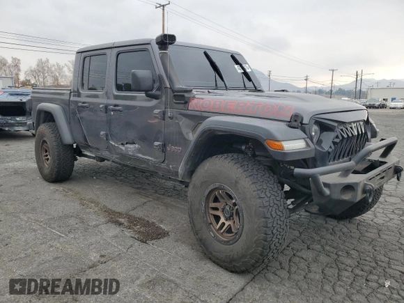 2021 Jeep Gladiator Rubicon with VIN 1C6JJTBG9ML512347, listed as a Copart auction lot 43197415 with 134,608 mi miles and Salvage title. Bid and sale history available at DreamBid. Image 4.