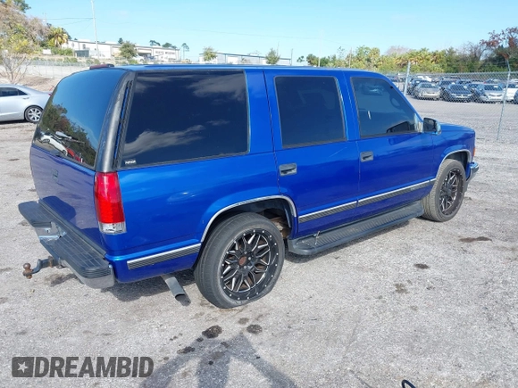 1997 GMC Yukon with VIN 1GKEC13R0VJ744958, listed as a IAAI auction lot 41474196 with 257,847 mi miles. Bid and sale history available at carsss.com. Image 4.
