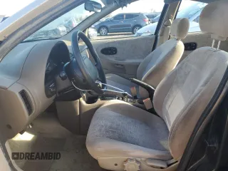 1999 Saturn SL z VIN 1G8ZK5270XZ212874, wystawiony jako Copart lot #85317464 z przebiegiem 153 477 mil mil oraz Szkoda całkowita • Salvage title. Historia ofert i sprzedaży dostępna na DreamBid. Obrazek 7.