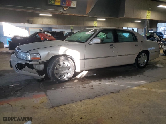 2003 Lincoln Town Car Cartier with VIN 1LNHM83W53Y695048, listed as a Copart auction lot 88715115 with 136,588 mi miles and Salvage Title. Bid and sale history available at carsss.com. Image 1.