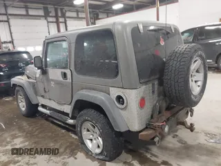 2005 Jeep Wrangler Rubicon with VIN 1J4FA69S65P311732, listed as a IAAI auction lot 41442147 with 174,277 mi miles. Bid and sale history available at carsss.com. Image 3.