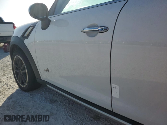 2016 MINI Countryman S with VIN WMWZC5C51GWU01290, listed as a Copart auction lot 77684384 with 106,811 mi miles and Salvage Title. Bid and sale history available at DreamBid. Image 12.