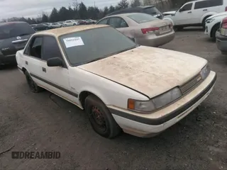1990 Mazda 626 with VIN 1YVGD22B1L5268943, listed as a IAAI auction lot 40503944 with 214,064 mi miles and . Bid and sale history available at DreamBid. Image 1.