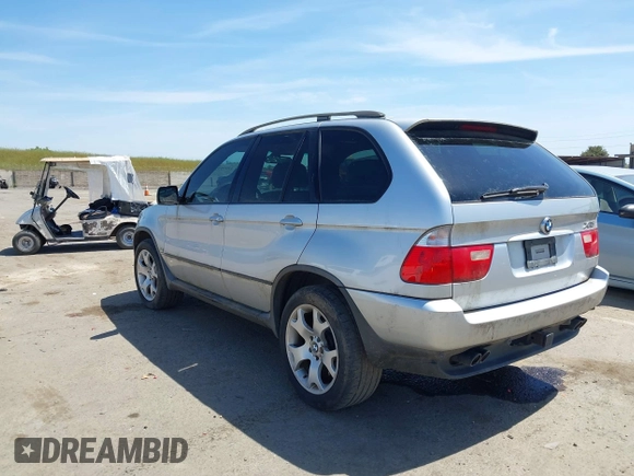 2001 BMW X5 4.4i with VIN WBAFB33511LH18797, listed as a IAAI auction lot 42075328 with 169,396 mi miles. Bid and sale history available at carsss.com. Image 3.