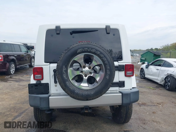 2017 Jeep Wrangler Unlimited Sahara with VIN 1C4BJWEG3HL752719, listed as a IAAI auction lot 41892600 with 127,486 mi miles. Bid and sale history available at carsss.com. Image 17.