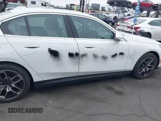 2024 BMW i5 eDrive40 with VIN WBY33FK03RCR99079, listed as a IAAI auction lot 42028540 with 28,827 mi miles and . Bid and sale history available at DreamBid. Image 6.
