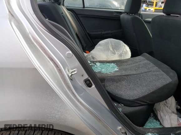 2012 Mitsubishi Lancer ES z VIN JA32U2FU3CU023450, wystawiony jako Copart lot #47019525 z przebiegiem Nie podano mil oraz Szkoda całkowita • Salvage title. Historia ofert i sprzedaży dostępna na DreamBid. Obrazek 10.