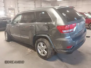 2012 Jeep Grand Cherokee Laredo with VIN 1C4RJFAG3CC209142, listed as a IAAI auction lot 41978296 with 201,796 mi miles. Bid and sale history available at carsss.com. Image 3.