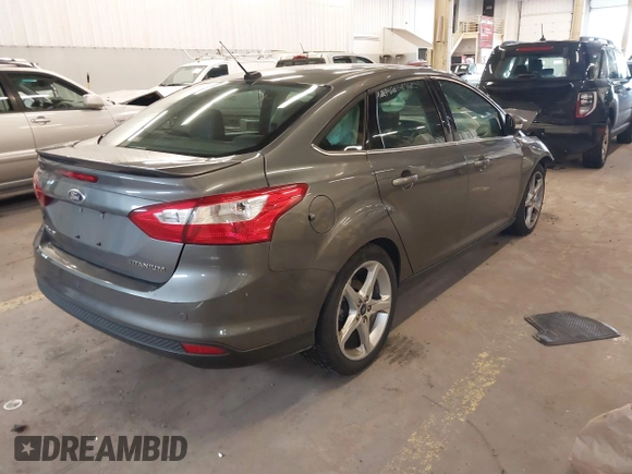 2013 Ford Focus Titanium with VIN 1FADP3J23DL265049, listed as a IAAI auction lot 41765621 with 100,550 mi miles and . Bid and sale history available at carsss.com. Image 4.