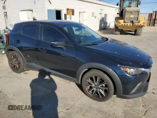 2017 Mazda CX-3 Touring z VIN JM1DKDC74H0165654, wystawiony jako Copart lot #41928295 z przebiegiem 173 567 mil mil oraz Szkoda całkowita • Salvage title. Historia ofert i sprzedaży dostępna na DreamBid. Obrazek 4.