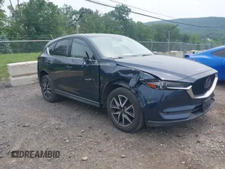 2018 Mazda CX-5 Grand Touring with VIN JM3KFBDMXJ0361812, listed as a IAAI auction lot 42509752 with 131,386 mi miles and . Bid and sale history available at DreamBid. Image 1.