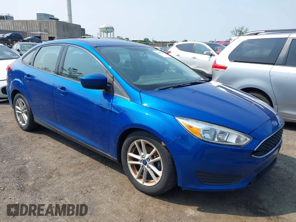 2018 Ford Focus SE z VIN 1FADP3FE1JL254632, wystawiony jako IAAI lot #42408683 z przebiegiem 74 696 mil mil oraz . Historia ofert i sprzedaży dostępna na DreamBid. Obrazek 1.