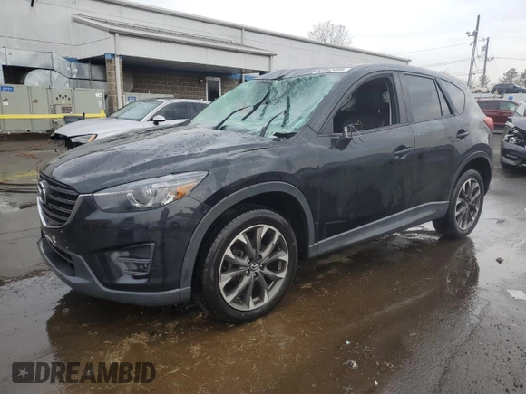 2016 Mazda CX-5 Grand Touring with VIN JM3KE4DYXG0711367, listed as a Copart auction lot 52862405 with 87,870 mi miles and Salvage Title. Bid and sale history available at DreamBid. Image 1.