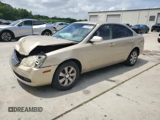 2008 Kia Optima LX z VIN KNAGE124085188763, wystawiony jako Copart lot #56009095 z przebiegiem 263 686 mil mil oraz Szkoda całkowita • Salvage title. Historia ofert i sprzedaży dostępna na DreamBid. Obrazek 1.