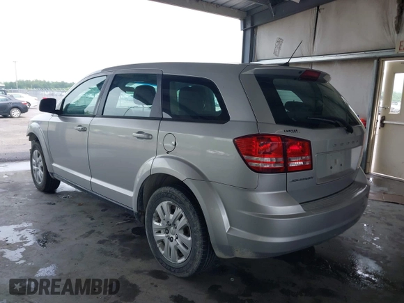 2014 Dodge Journey SE with VIN 3C4PDCAB1ET194066, listed as a IAAI auction lot 42117527 with 184,490 mi miles and . Bid and sale history available at carsss.com. Image 3.