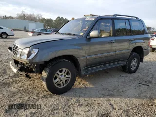 2001 Lexus LX 470 with VIN JTJHT00W913510861, listed as a Copart auction lot 87299734 with 235,310 mi miles and Salvage Title. Bid and sale history available at carsss.com. Image 1.