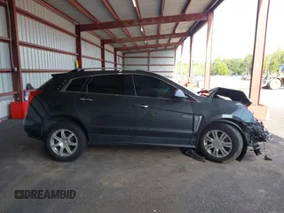 2016 Cadillac SRX Luxury Collection z VIN 3GYFNEE39GS555747, wystawiony jako IAAI lot #42347516 z przebiegiem 143 061 mil mil oraz . Historia ofert i sprzedaży dostępna na DreamBid. Obrazek 14.