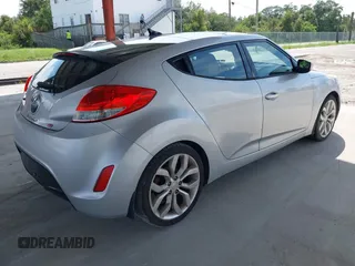 2012 Hyundai Veloster w/Gray Int z VIN KMHTC6ADXCU056898, wystawiony jako IAAI lot #40366687 z przebiegiem 137 161 mil mil oraz . Historia ofert i sprzedaży dostępna na DreamBid. Obrazek 4.