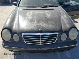 2000 Mercedes-Benz E-Class with VIN WDBJF70JXYB091085, listed as a Copart auction lot 77136484 with 185,429 mi miles and Salvage Title. Bid and sale history available at carsss.com. Image 11.